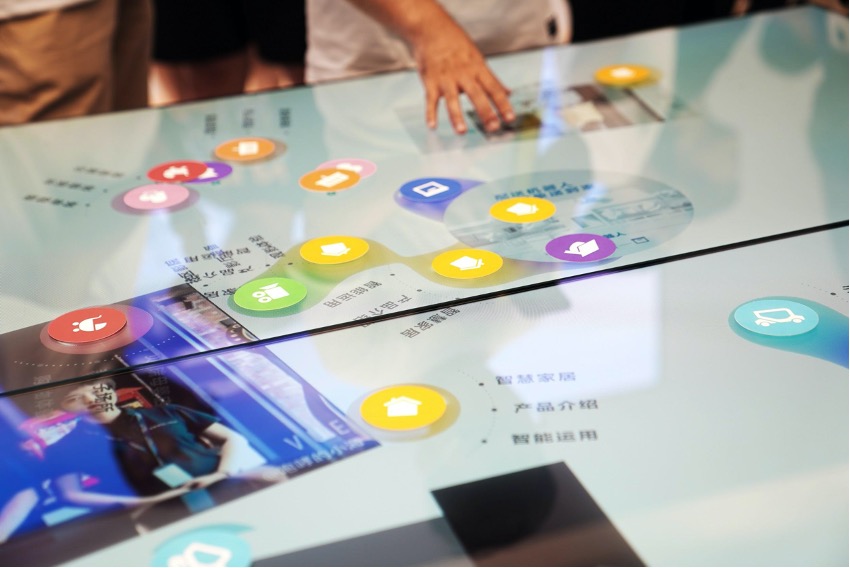 A person interacting with a virtual screen