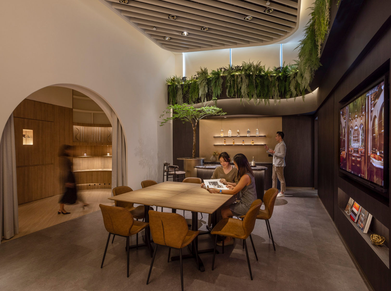 3 women and a man in a space that looks like a cafde