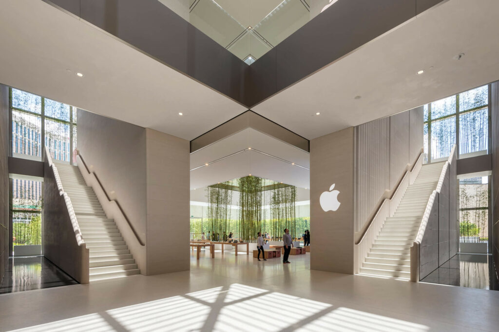An Apple store in Macau with open windows and greenery indoors